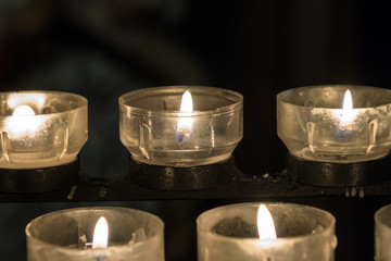 Burning candles on a candlestick in the church