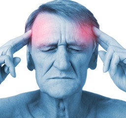 Closeup headshot senior man suffering from headache hands on head with red colored inflamed areas ...