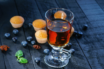 Tea cup, muffins and blueberry 