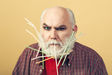 old man with drinking straws in beard