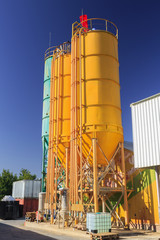 Three high metal towers on chemical plant