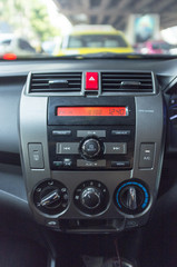Fototapeta premium Inside view of front dashboard panel of car interior