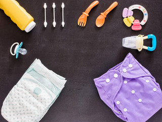 Flat lay of baby set with cloth diaper