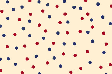 Red and blue polka dots on yellow background