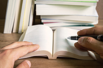 Stack of books on wooden table, Education background