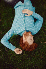 Portrait of a ginger man relaxing on the grass