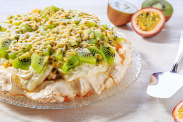 Meringue Pavlova  with whipped cream and fresh fruit.