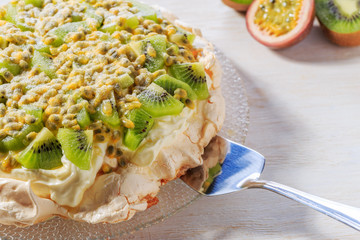 Meringue Pavlova  with whipped cream and fresh fruit.