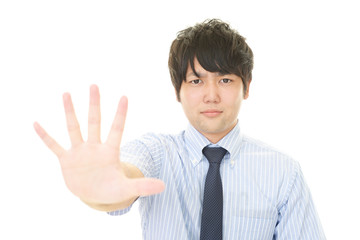 ストップのジェスチャーをする男性