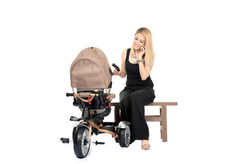 Woman with baby and pram isolated on white