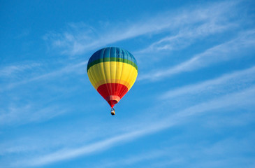 Colorful air balloon in blue sky