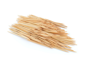 Pile of wooden toothpicks isolated on white. Bunch of toothpicks