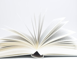 Fototapeta premium Book opened up against pure white background
