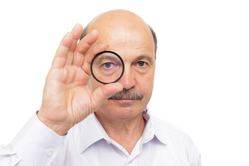 man is holding a protective filter for the lens and look through