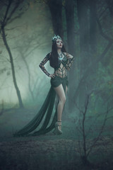 dark evil queen stands in the magic forest, wild Princess , vampire , hip toning , creative color,dark boho