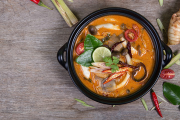 spicy soup traditional food cuisine in Thailand on wooden backgr