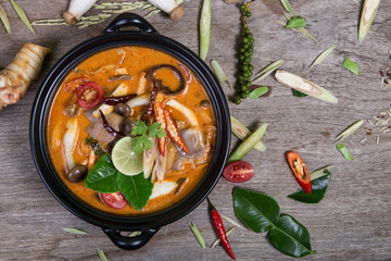 spicy soup traditional food cuisine in Thailand on wooden backgr