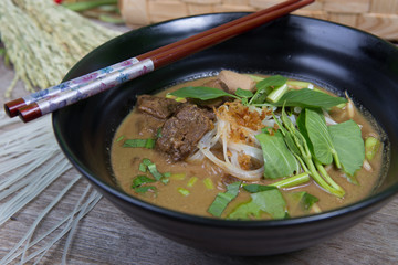 asian noodle soup with pork meatball with fresh vegetable  (Vege
