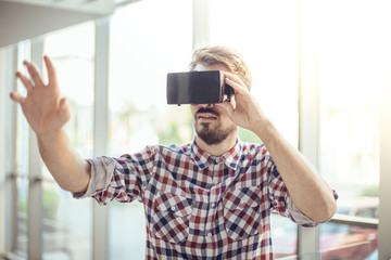 Young man with virtual reality goggles
