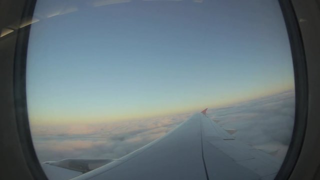 Airplane flies above the cloud