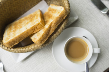 Toast and coffee in top view.