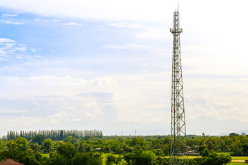 electrical post by the road against blue sky