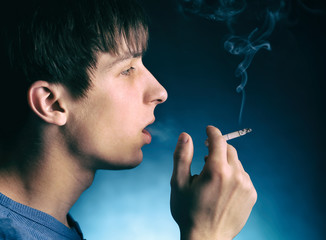 Young Man smoke a Cigarette