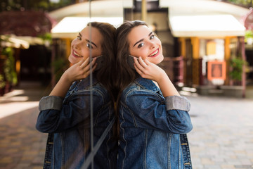Young girl talk phone on the street