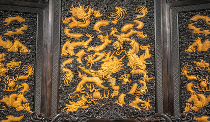 wooden carving of dragon with luxurious material in ancient China
- 115383450