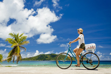 Fototapeta premium Woman ride along The Beach