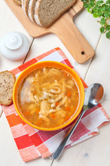 Traditional polish tripe soup with vegetables.