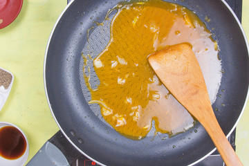 Cooking orange sauce for fish steak