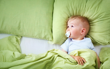 One year old baby in the bed