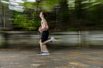 Obraz premium Young Man Running In Park