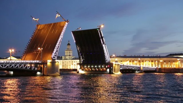 raise Palace Bridge across river Neva and Kunstkamera, Saint-Petersburg, Russia

