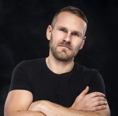 Man on a dark background.