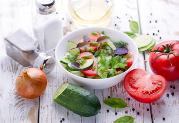 Salad. Tomatoes, cucumbers and onion.