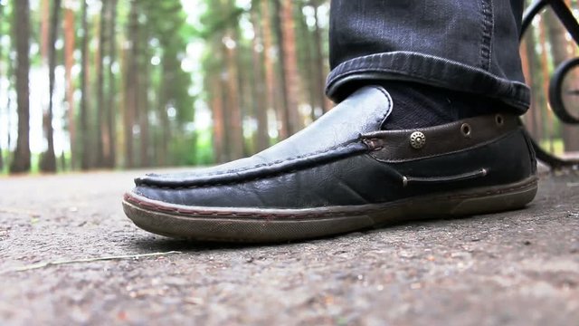 Black patent leather men's shoes stomping or fills rhythm on open air