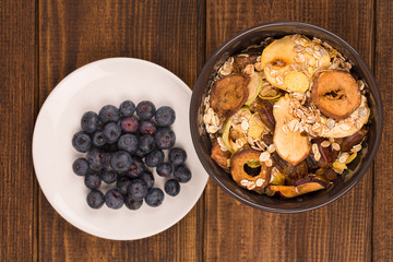 good breakfast, Organic Breakfast Quinoa with Nuts Milk and Berries, Breakfast oatmeal porridge with cinnamon, cranberries and blueberries, , selective focus, close up, front view