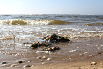 message in a bottle stranded on the beach