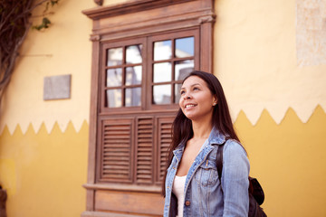 Dreamy young girl with a back pack