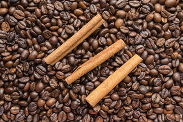 cinnamon sticks on the coffee bean Brown background
