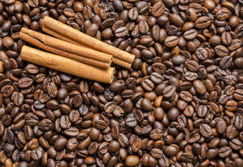 cinnamon sticks on the coffee bean Brown background