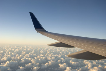 Airplane Wing and Clouds