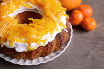 Delicious citrus cake on wooden background