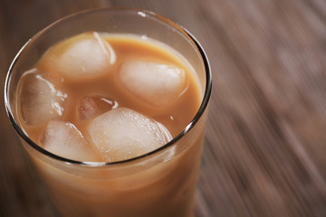 Cold coffee on wooden table