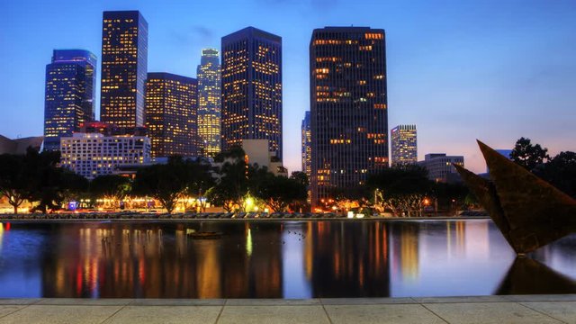 4K UltraHD View at dusk of Los Angeles skyscrapers with reflecting pool in the foreground