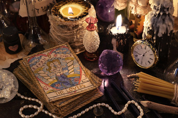 The tarot cards with crystal, candles and magic objects - obrazy, fototapety, plakaty