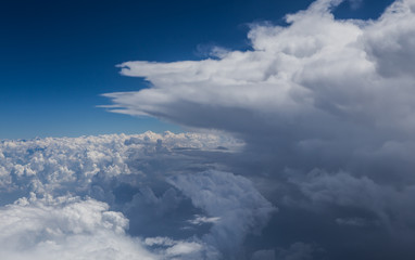 Naklejka premium clouds and blue sky seen from plane
