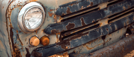Front view of rusty abandoned truck